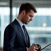 Portrait of a focused male technical specialist working with a premium laptop